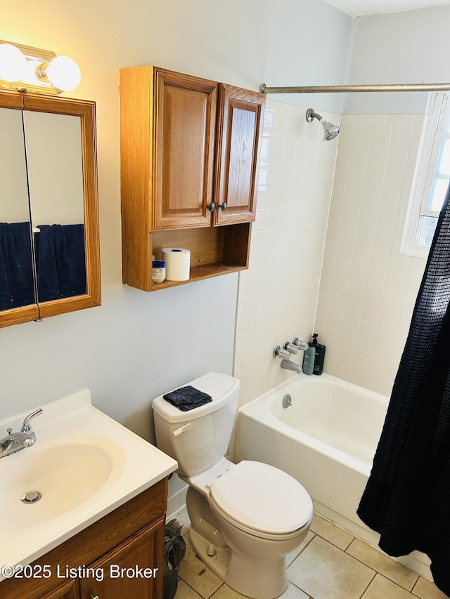 bathroom featuring shower / bath combination with curtain, vanity, tile patterned flooring, and toilet