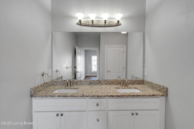 bathroom with double vanity and a sink