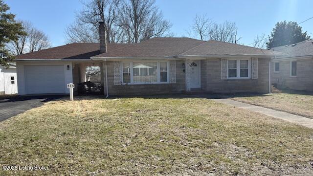 ranch-style house featuring a front lawn, driveway, and an attached garage