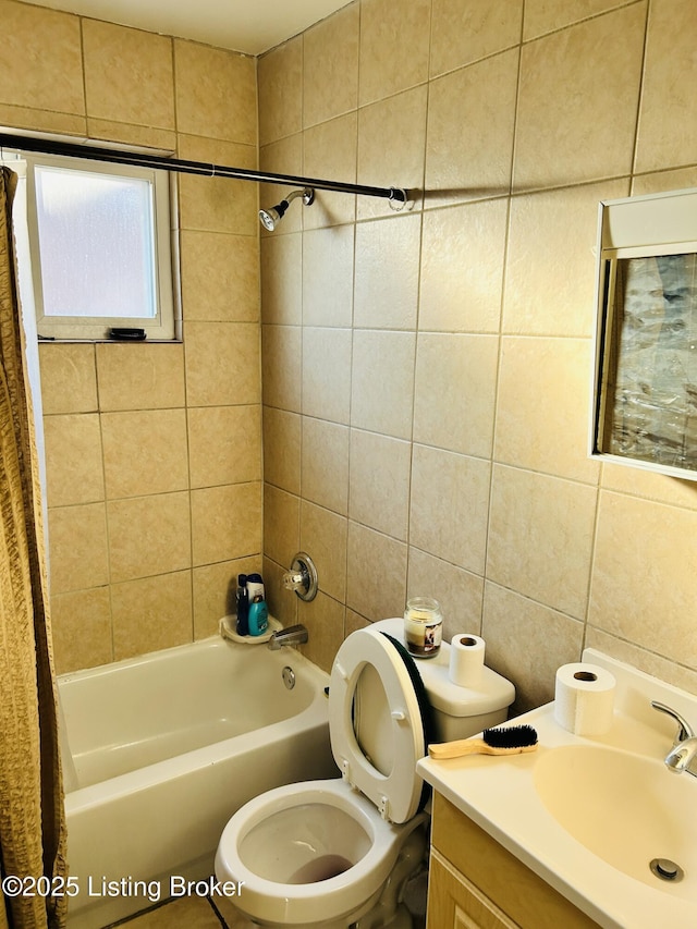 full bathroom with tile walls, vanity, toilet, and shower / bathtub combination with curtain