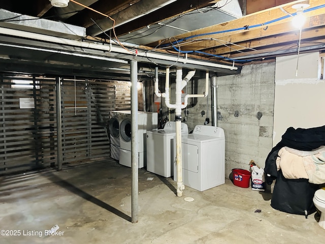 unfinished basement with independent washer and dryer