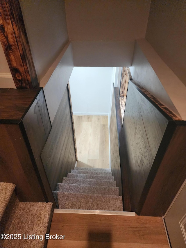 staircase with wood finished floors