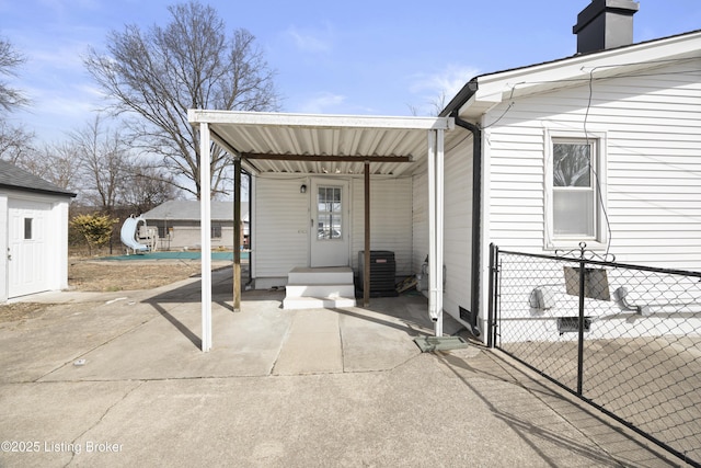 exterior space featuring fence and central AC