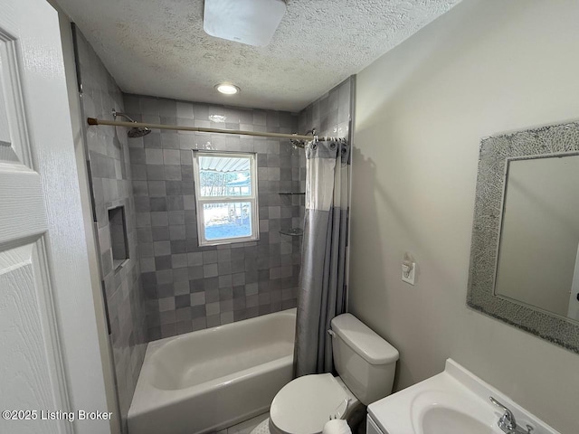 full bathroom with shower / bathtub combination with curtain, a textured ceiling, toilet, and vanity