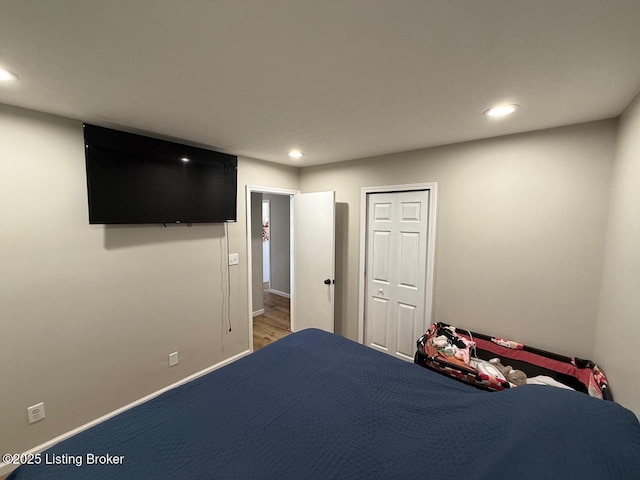 unfurnished bedroom featuring baseboards and recessed lighting