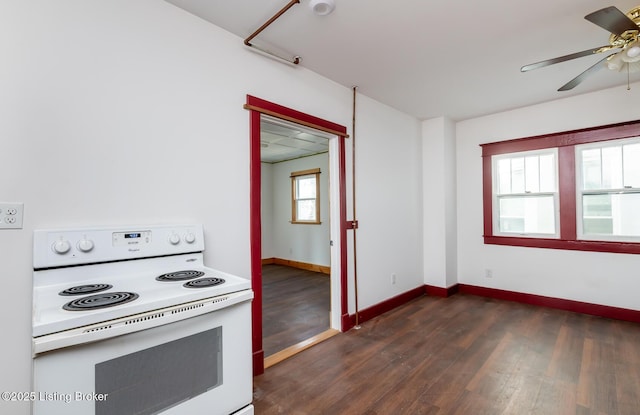 kitchen with a ceiling fan, white range with electric stovetop, dark wood-style flooring, and baseboards