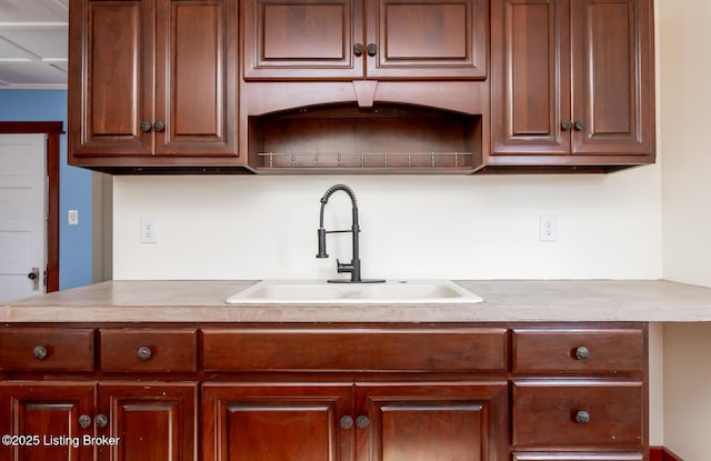 kitchen with light countertops and a sink