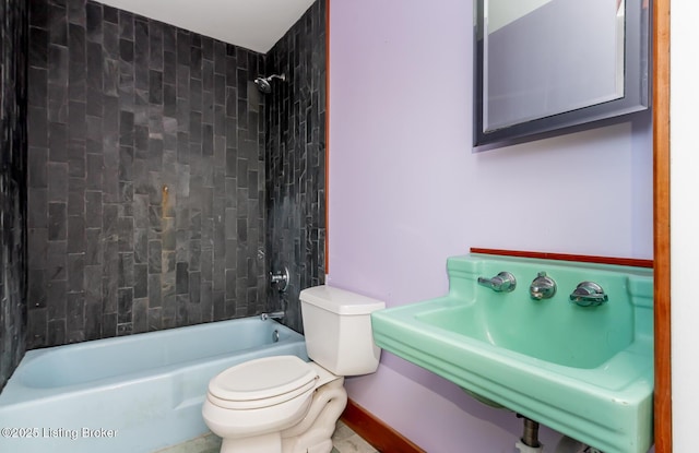 full bathroom with  shower combination, a sink, and toilet