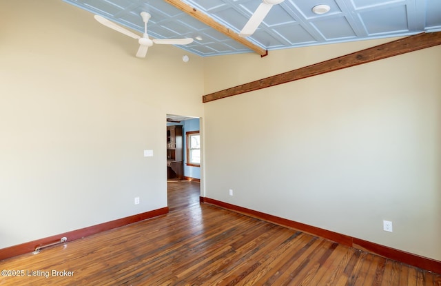 unfurnished room featuring baseboards and hardwood / wood-style floors