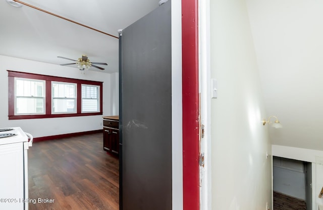 hall featuring dark wood finished floors and baseboards