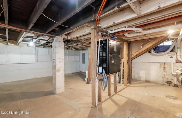 unfinished basement featuring electric panel