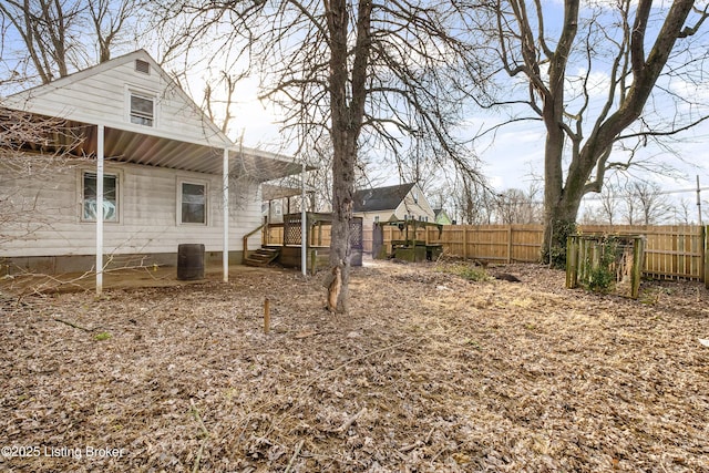 view of yard with central AC and fence