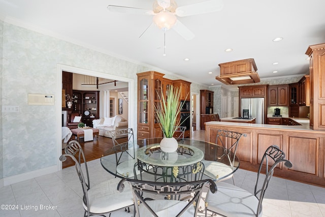 dining area featuring light tile patterned floors, recessed lighting, ornamental molding, a ceiling fan, and baseboards