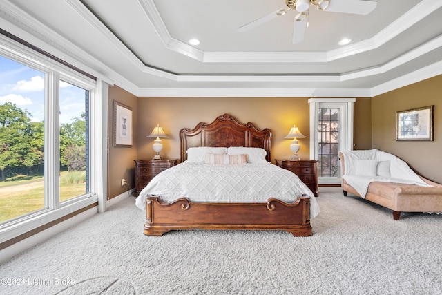 bedroom featuring crown molding, a ceiling fan, a raised ceiling, and carpet flooring