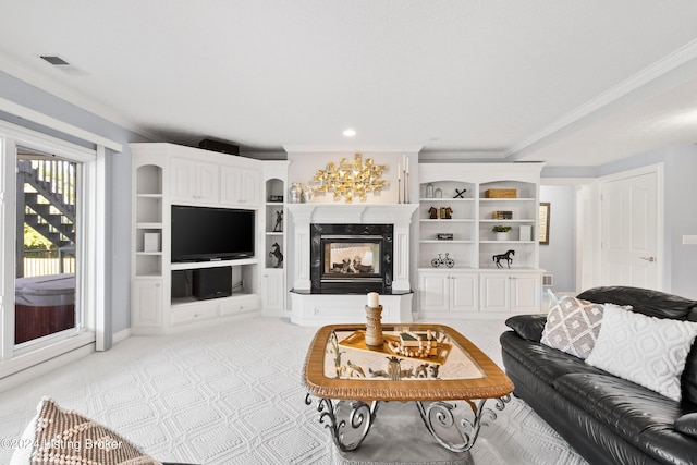 living room featuring light colored carpet, visible vents, ornamental molding, and a high end fireplace