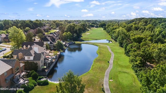 birds eye view of property with golf course view, a water view, and a residential view