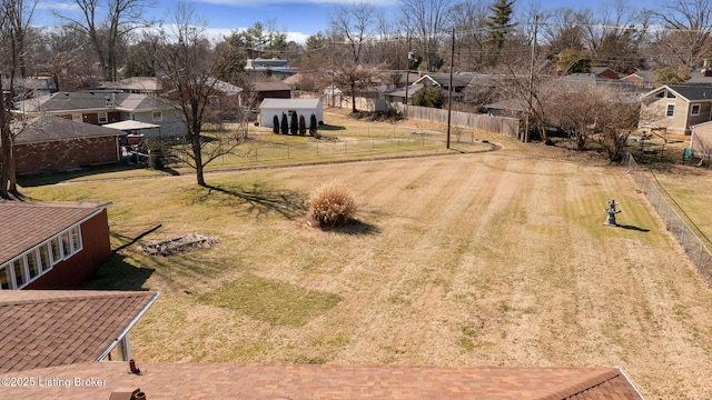 birds eye view of property with a residential view