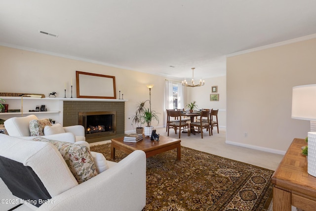 carpeted living room featuring a fireplace, crown molding, visible vents, a chandelier, and baseboards