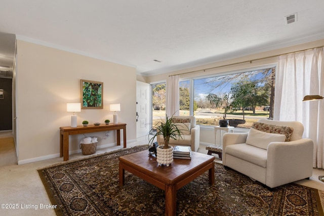 living room with crown molding, carpet flooring, visible vents, and baseboards