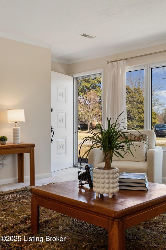 interior space featuring visible vents and crown molding