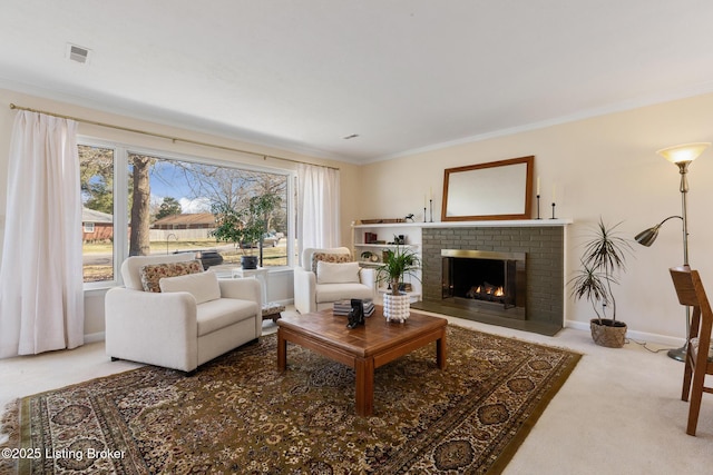 carpeted living area with baseboards, a fireplace, visible vents, and ornamental molding