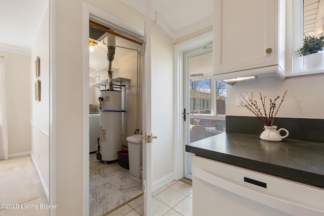 interior space featuring crown molding, baseboards, and gas water heater