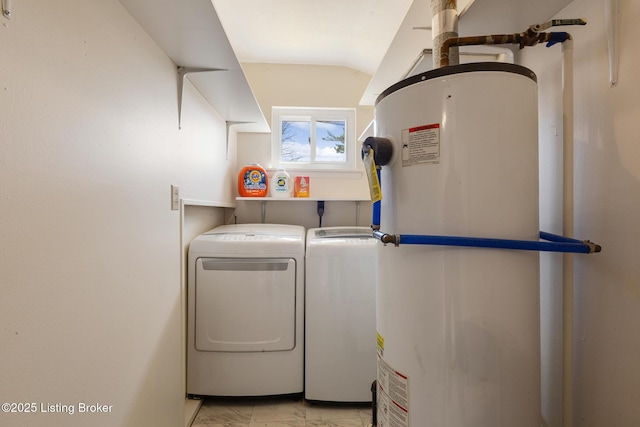 washroom with gas water heater, laundry area, and independent washer and dryer