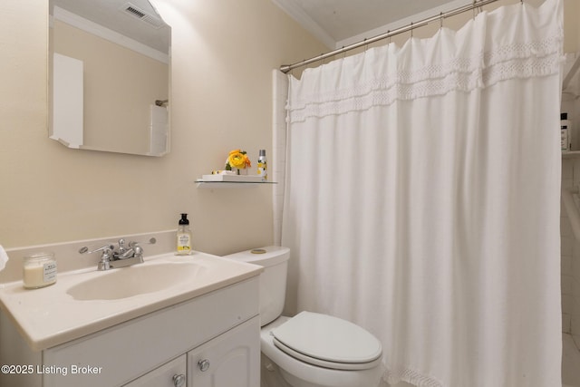 full bathroom featuring toilet, vanity, visible vents, and crown molding