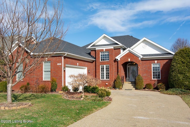 traditional-style house featuring a garage, driveway, brick siding, and a front lawn