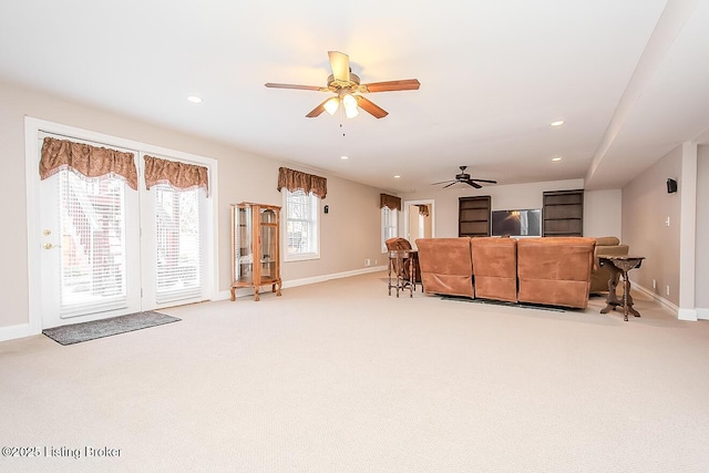 carpeted living room with ceiling fan, recessed lighting, and baseboards