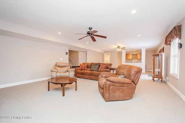 living area with decorative columns, recessed lighting, a ceiling fan, light carpet, and baseboards