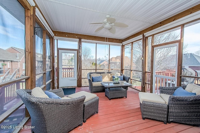 sunroom with a ceiling fan