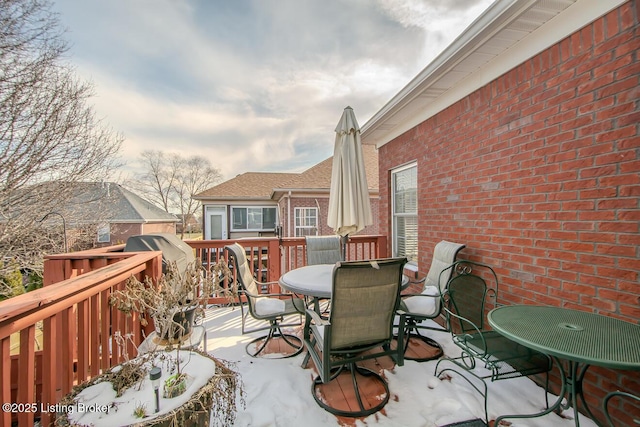 view of patio / terrace featuring outdoor dining area and a deck