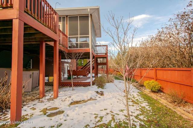 exterior space featuring a deck, fence, and stairway