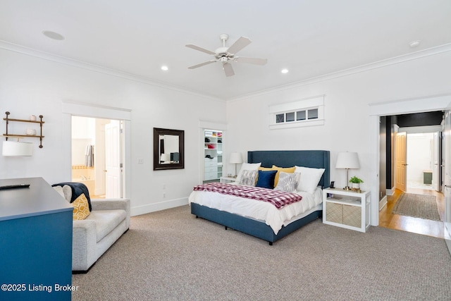 carpeted bedroom featuring recessed lighting, crown molding, and baseboards