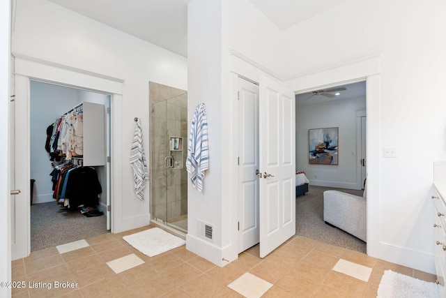 interior space with light colored carpet, visible vents, and baseboards