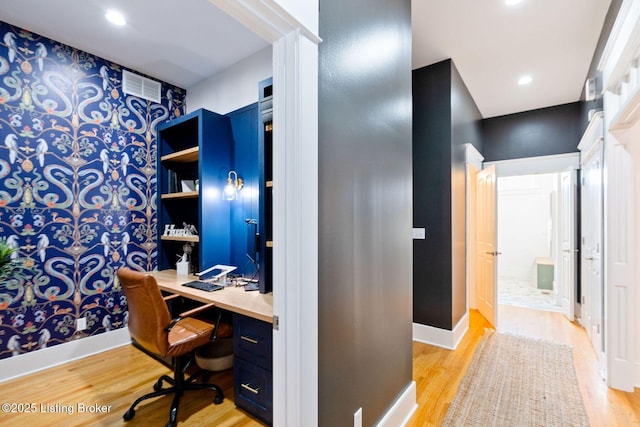 office space featuring baseboards, recessed lighting, visible vents, and light wood-style floors