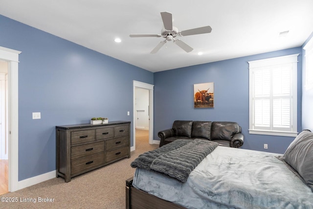 bedroom featuring recessed lighting, light colored carpet, ceiling fan, and baseboards