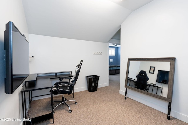 office area with lofted ceiling, baseboards, and carpet