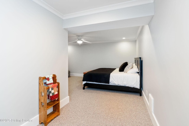 bedroom featuring carpet flooring, crown molding, and baseboards