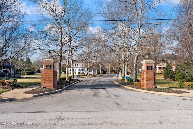 view of road with curbs and street lighting