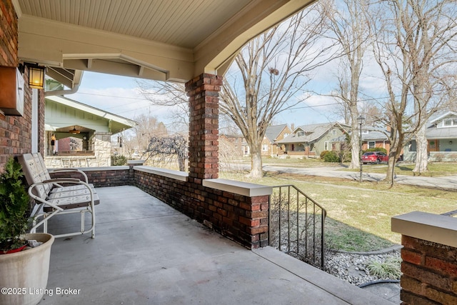 view of patio with a residential view and covered porch