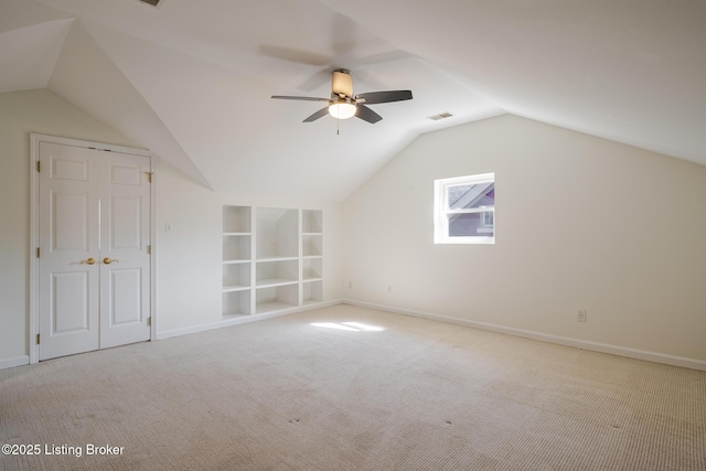 additional living space featuring baseboards, carpet flooring, visible vents, and built in features