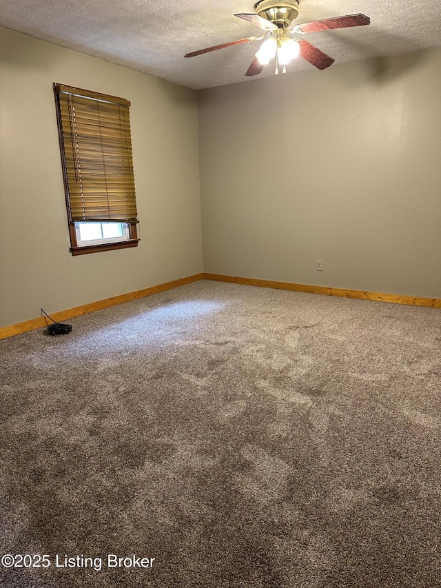 1683 Anneta Rd, Leitchfield, KY 42754 - spare room featuring a textured ceiling, carpet floors, a ceiling fan, and baseboards