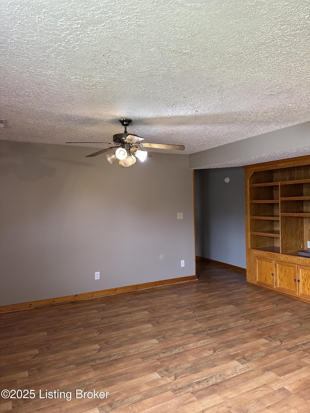 1683 Anneta Rd, Leitchfield, KY 42754 - spare room with a ceiling fan, wood finished floors, a textured ceiling, and baseboards