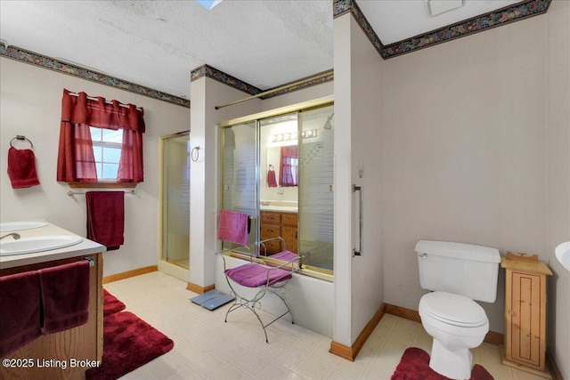 full bathroom with an enclosed shower, vanity, and tile patterned floors