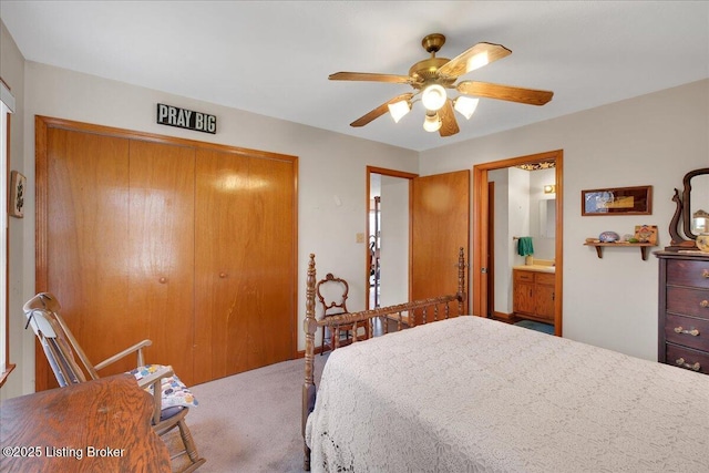 carpeted bedroom with a ceiling fan and a closet