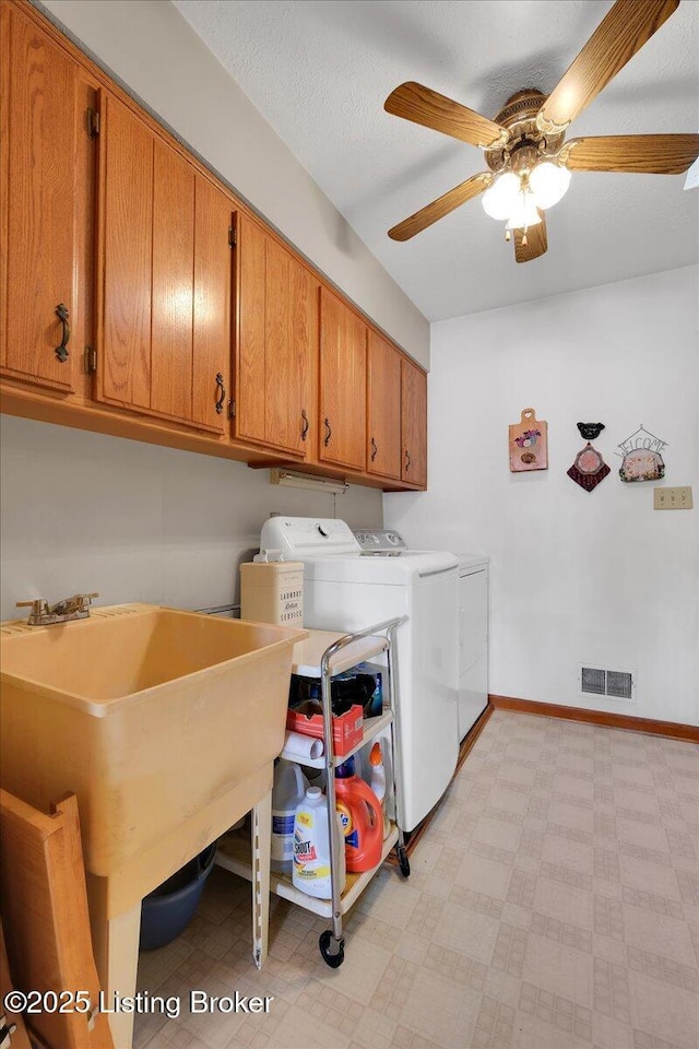 laundry area with light floors, cabinet space, visible vents, washer and dryer, and baseboards