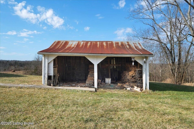 view of pole building with a lawn