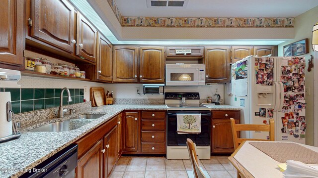 kitchen with white appliances, light tile patterned floors, a sink, and open shelves